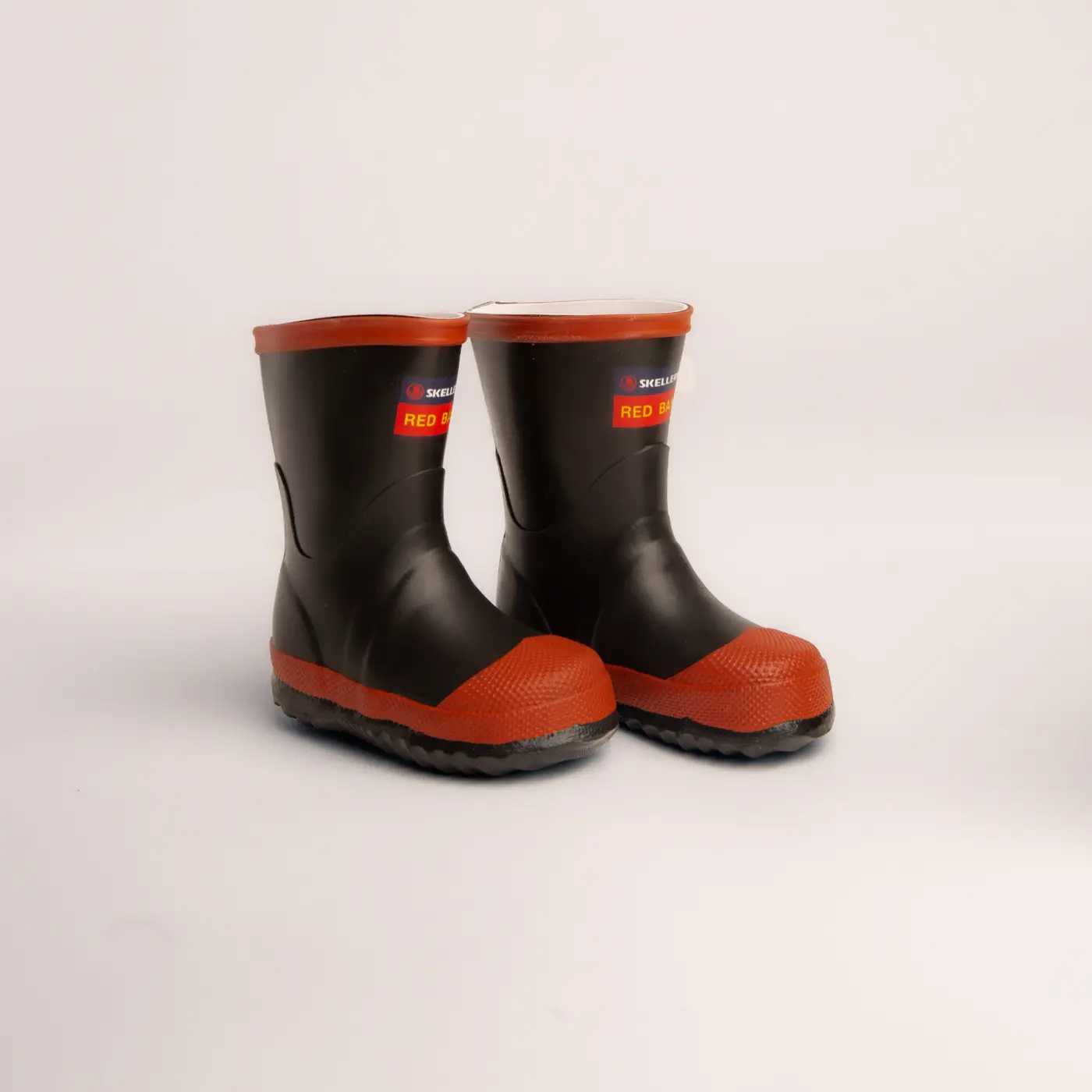 A pair of small kids red band boots