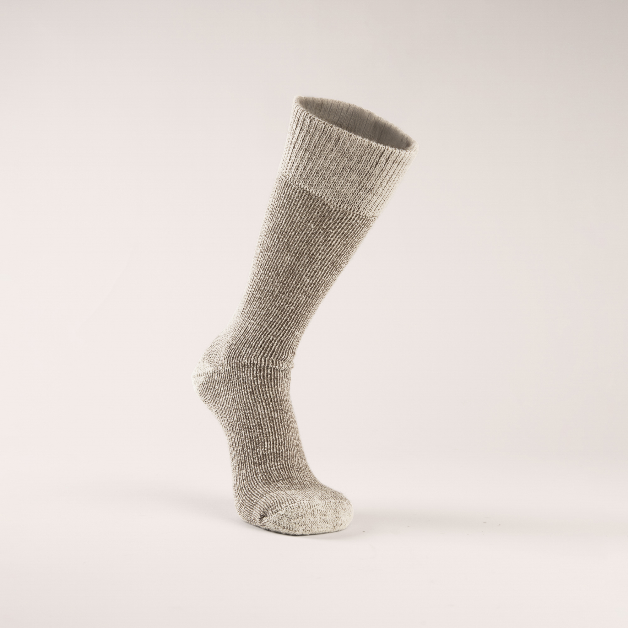 Grey woolen sock in a running position